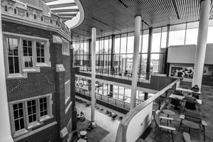 Black and white photo showing the exterior of ARH within the atrium of the HSSC