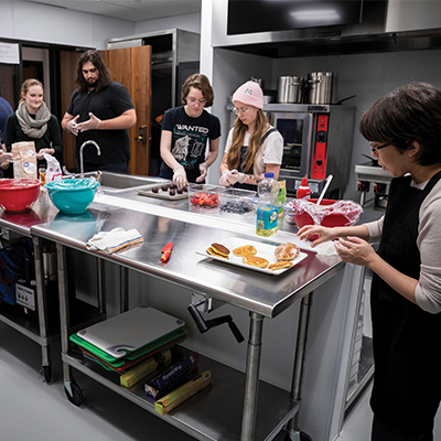 Students preparing food in commercial quality kitchen