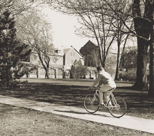 Bicyclist heading to South Loggia, Main Hall in the background