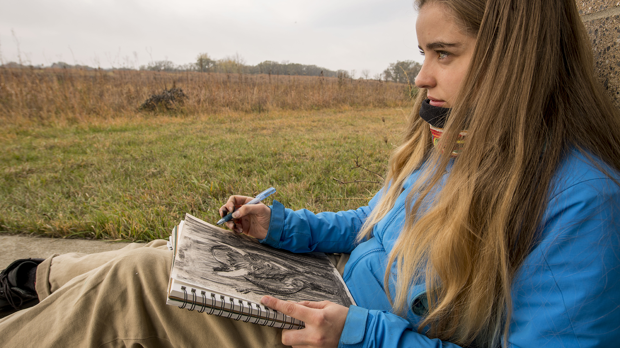 Students in Lee Running, Associate Professor of Art, drawing class use observational drawing techniques during a trip to the Conrad Evironmental Research Area