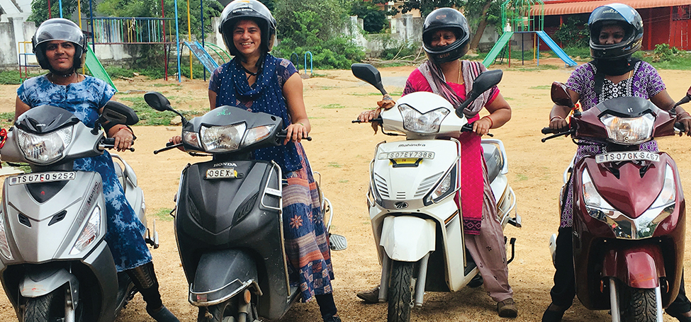 Four women on motorcycles