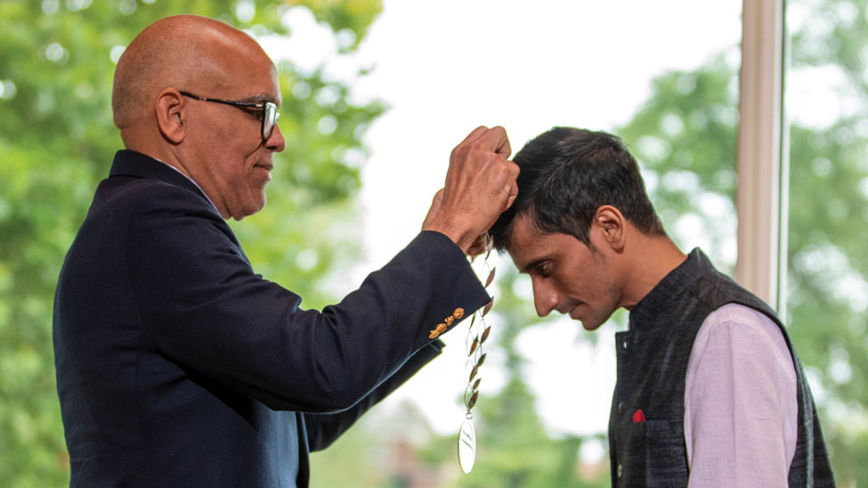 Raynard S. Kington bestowing the medal on the 2019 winner Shafiq R. Khan