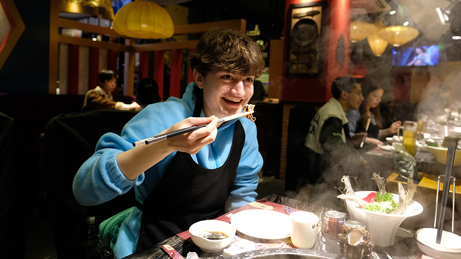 Katie Mehltretter ’20 tries baby octopus at a hotpot restaurant