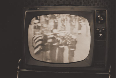 Console TV showing image of JFK's funeral