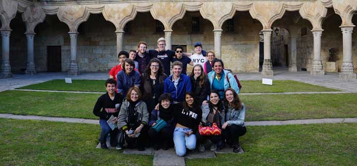 The Origin of Liberal Education tutorial group gathers in front of the University of Salamanca