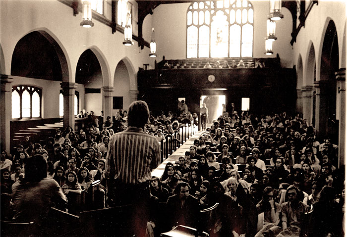 A 1972 peace rally in Herrick Chapel featuring Richard H. Stein ’72 speaking to the attendees