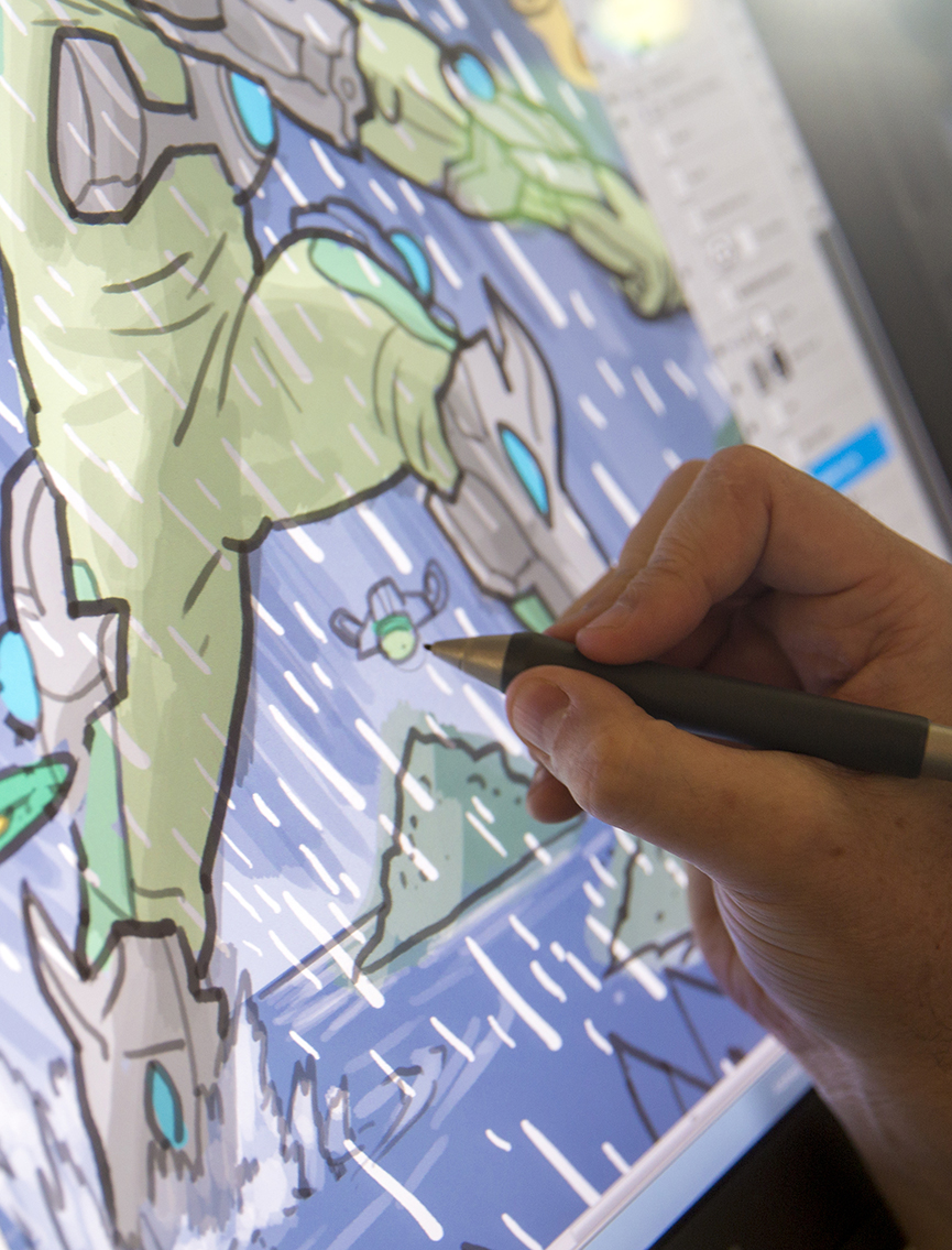 close up of hand drawing digital comic on screen