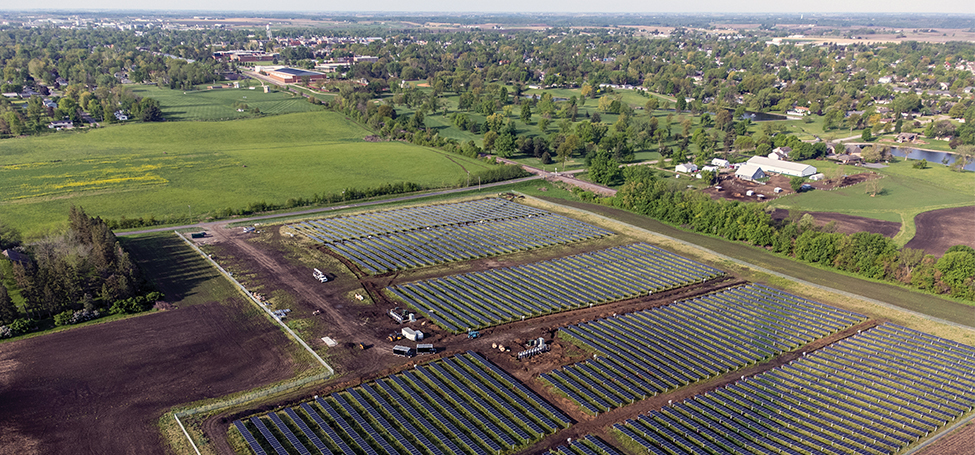 mid-size solar array in a green field