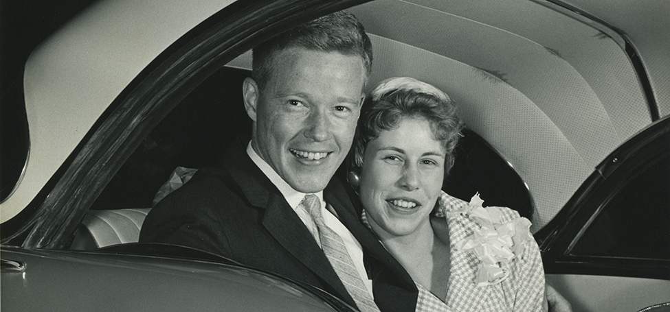 George and Sue in the backseat of a car after their wedding