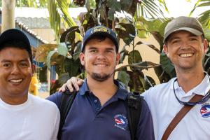 Mansir Petrie ’99, right, pictured with Peace Corps colleagues in Panama in February 2020.