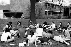 Students lounge in a ring near Zirkle's sculpture on central campus 