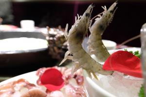 Food dish with dancing prawns