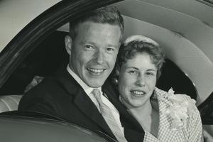 George and Sue in the backseat of a car after their wedding