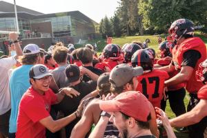 Grinnell College football team celebrating